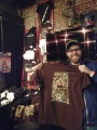 Cartoonist Alec Longstreth with a t-shirt he designed for the Everything Will Be Alright in the End Tour.[1]